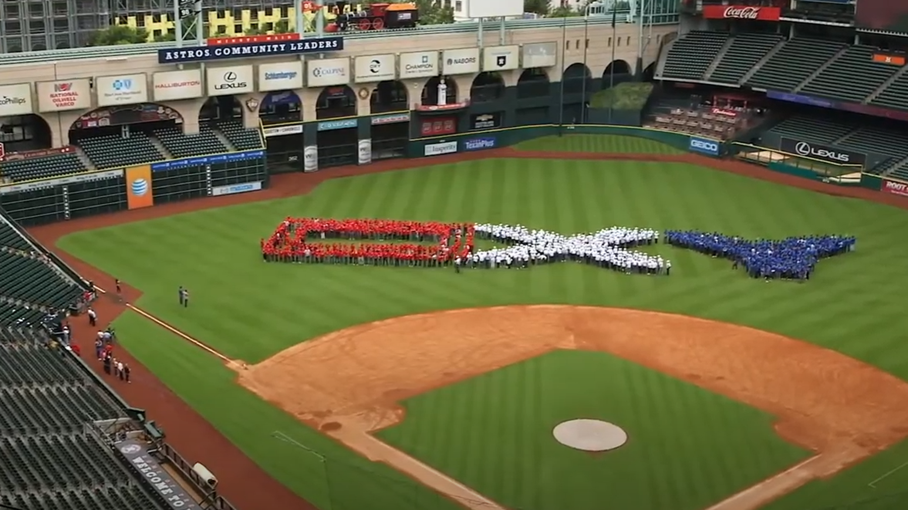 Employees spelling out Oxy on Minute Maid Field